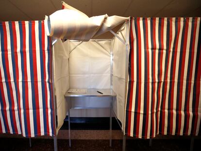 A booth is ready for a voter, Feb. 24, 2020, at City Hall in Cambridge, Mass., on the first morning of early voting in the state.