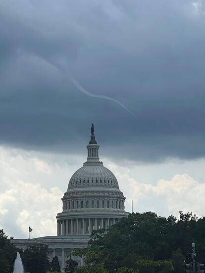 This photo provided by Peter Kiley shows a small funnel cloud over the U.S. Capitol dome on Tuesday, July 25, 2023 in Washington.