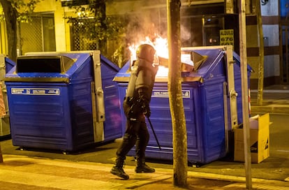 A riot officer near a burning container in Logroño, Spain on Saturday night. 