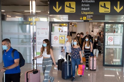 Tourists arrive at the Son Sant Joan airport in Palma de Mallorca on July 8, 2020.