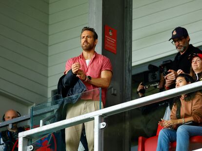 Ryan Reynolds, a proud wearer of pleated khakis, alongside Hugh Jackman at a Wrexham soccer game in early August.