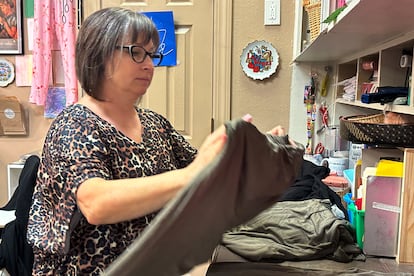 Stephanie Herbig, the owner of the boutique Cheeky Bird, works at the business in Kansas City, Mo., on Tuesday, March 14, 2023.