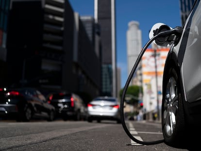 An electric vehicle is plugged into a charger in Los Angeles, on August 25, 2022.