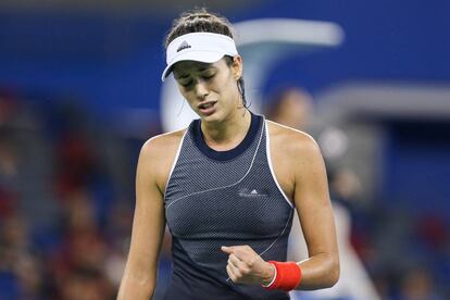 Muguruza celebra un punto durante el partido ante Linette en Wuhan.