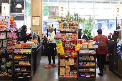 People shop at Lincoln Market