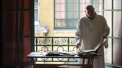 Carlos Tobes Arrabal examines the books containing the falsified baptism certificates.