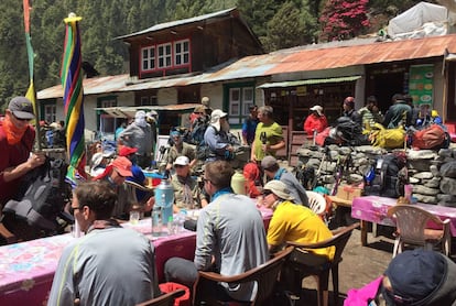 This April 6, 2016 photo shows trekkers at a rest stop north of the village of Namche Bazaar, Nepal. April falls into the peak season for trekking and the trail is often crowded. A trek to Everest Base Camp along mountain paths that hug deep gorges offers renewal and a test of mental and physical limits. Along the way there are sore knees and altitude sickness, but the spectacular landscapes, friendly villagers and moments of tranquility make the journey an unforgettable experience. (AP Photo/Karin Laub)