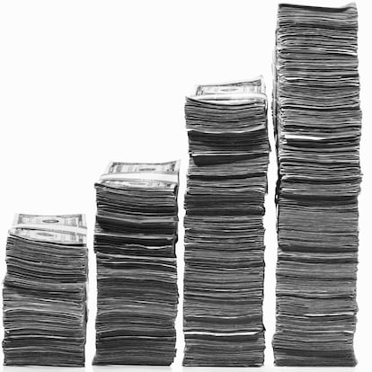 Stacks of US currency in ascending graph pattern