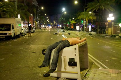 A reveller lies prostrate after street violence erupted in Lloret de Mar on Thursday.