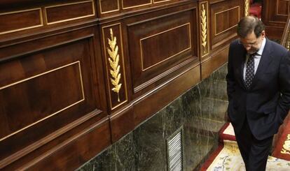 Prime Minister Mariano Rajoy leaves parliament Thursday after casting his vote for the austerity package.