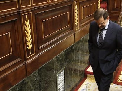 Prime Minister Mariano Rajoy leaves parliament Thursday after casting his vote for the austerity package.