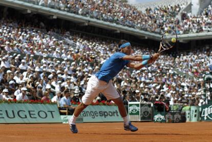 Nadal returns during the final against Roger Federer.