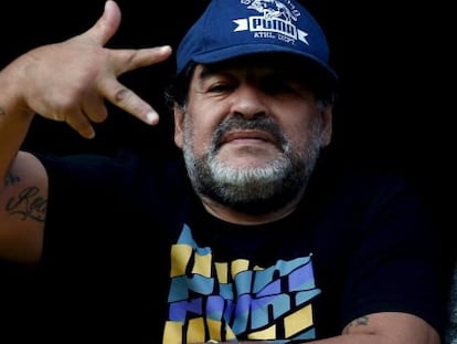 Maradona signals to photographers at the stadium during 'La Bombonera' match in Argentina.