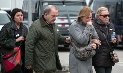 Relatives of the victims stand outside Barcelona airport. Spanish Deputy Prime Minister Soraya Sáenz de Santamaría said the black box found in the Alps would shed light on the causes of the crash, and asked for caution when it came to making hypotheses.