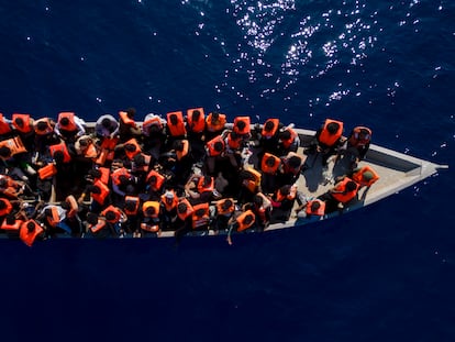 Migrants from Eritrea, Libya and Sudan sail a wooden boat before being assisted by aid workers of the Spanish NGO Open Arms, in the Mediterranean Sea, on June 17, 2023.