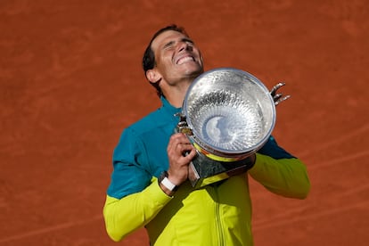 Rafael Nadal lifts the trophy after winning the French Open against Casper Ruud in Paris, Sunday, June 5, 2022. 