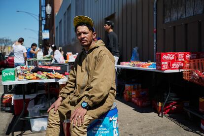 Antonio Contreras with the products he sells to other migrants, outside the shelter where he sleeps, mid-April 2024.