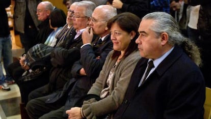 Fidel Pallerols (with ponytail) sits next to his wife, Mari Cruz Guerrero, during his trial.