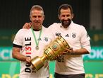 Soccer Football - DFB Cup - Final - Bayer Leverkusen v Bayern Munich - Olympiastadion, Berlin, Germany - July 4, 2020 Bayern Munich coach Hansi Flick and Bayern Munich Sport Director Hasan Salihamidzic celebrate with the trophy after winning the DFB Cup, following the resumption of play behind closed doors after the outbreak of the coronavirus disease (COVID-19)  Alexander Hassenstein/Pool via REUTERS  DFB regulations prohibit any use of photographs as image sequences and/or quasi-video