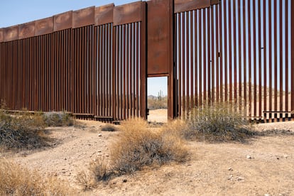 A disconcerting open door in the wall that separates Mexico and the United States. On the other side of the door is Arizona.