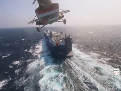 Houthi military helicopter flies over the Galaxy Leader cargo ship in the Red Sea in this photo released November 20, 2023.