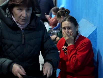 People take shelter inside a building in Mariupol, Ukraine.