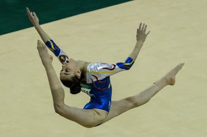 Romania's Dora Vulcan performs on the floor during the artistic gymnastics test event for the Rio 2016 Olympic Games at the Rio Olympic Arena in the Olympic Park in Rio de Janeiro, Brazil, on April 17, 2016. / AFP PHOTO / YASUYOSHI CHIBA