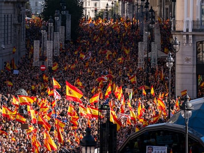 Crowds with Spanish flags pack Puerta del Sol during a protest called by Spain's Popular Party in Madrid on November 12.