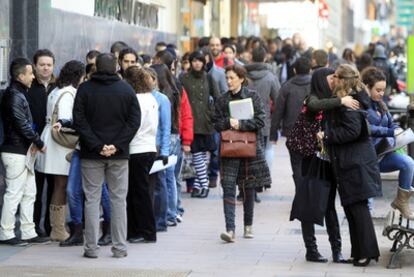 Hundreds of applicants wait outside the building in Madrid where Disney recruiters were doing interviews.