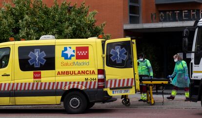 An ambulance taking people out of the Monte Hermoso senior residence in Madrid.