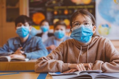 Students wear face masks in school