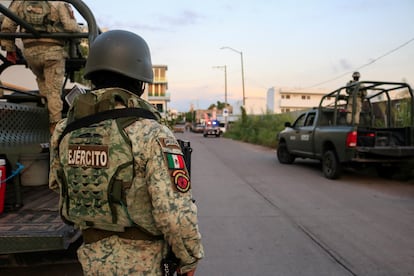 Soldiers guard a scene after a confrontation between municipal police and gunmen, in Culiacán, Mexico, September 21, 2024. 