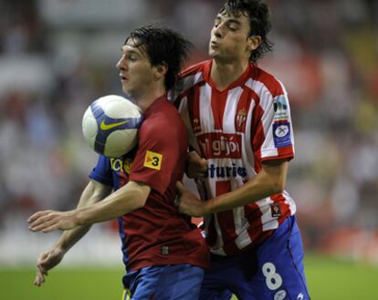 Míchel, junto a Messi, en su etapa en el Sporting.