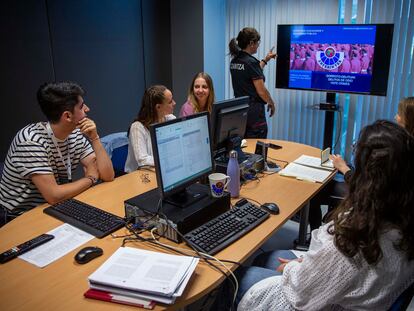 University students attend a class on hate crimes in Spain.