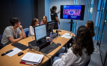 University students attend a class on hate crimes in Spain.