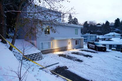 Bare spots are seen, Nov. 29, 2022, in the snowy parking lot in front of the home where four University of Idaho students were found dead on Nov. 13, in Moscow, Idaho, after vehicles belonging to the victims and others were towed away earlier in the day.