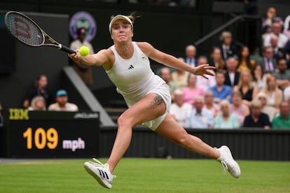 Ukraine's Elina Svitolina returns the ball to Poland's Iga Swiatek during their women's singles quarter-finals tennis match on the ninth day of the 2023 Wimbledon Championships at The All England Tennis Club in Wimbledon, southwest London, on July 11, 2023.