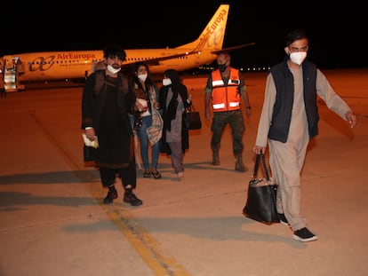 A group of Afghan evacuees arrives at the Torrejón de Ardoz air base in Madrid.