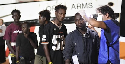 Migrants get medical checked after disembarking from the ‘Open Arms’ rescue ship.