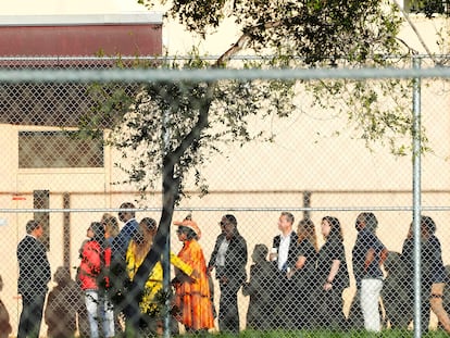 Nine members of Congress wait to enter Marjory Stoneman Douglas High School, Friday, Aug. 4, 2023, in Parkland, Fla.