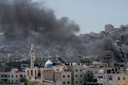 Smoke rises during an Israeli military raid of the militant stronghold of Jenin in the occupied West Bank, Monday, July 3, 2023.