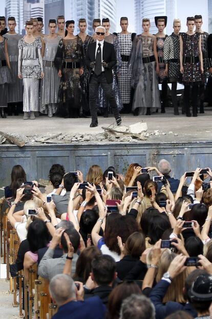 German designer Karl Lagerfeld (front C) appears with models at the end of his Haute Couture Fall Winter 2013/2014