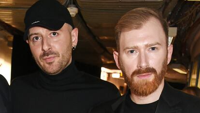 One of the few public photographs of the Gvasalia brothers together: Demna (left) and Guram (right) at the 2016 Fashion Awards in London.