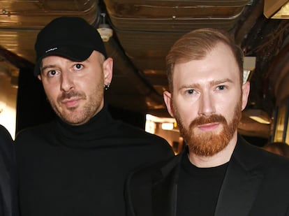 One of the few public photographs of the Gvasalia brothers together: Demna (left) and Guram (right) at the 2016 Fashion Awards in London.