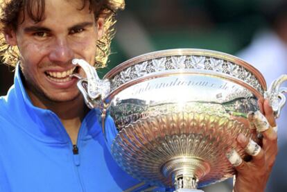 Rafa Nadal tests out the cup, his sixth French Open trophy.