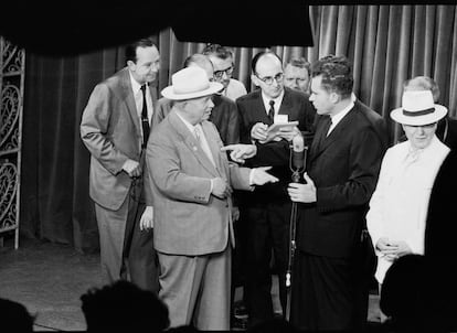 After their tense exchange in the Splitnik kitchen, Khrushchev and Nixon continue their impromptu debate in a television studio, which was later broadcast on American and Soviet television. 