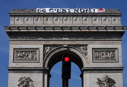 CGT unionists display a giant banner written "64, it's no" on the top of the Arc de Triomphe monument