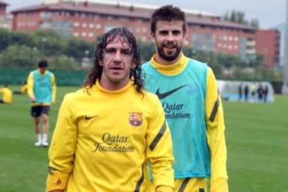 Puyol y Piqué, en el entrenamiento del Barcelona.