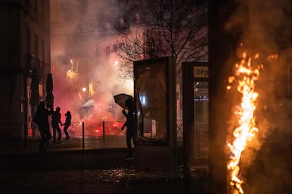 Demonstrators face French police during a demonstration in Dijon, central France, March 20, 2023.