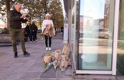 Flowers are put in place at the bank branch, where two football supporters from Sweden were shot dead in a terror attack in Brussels, Belgium, 17 October 2023.